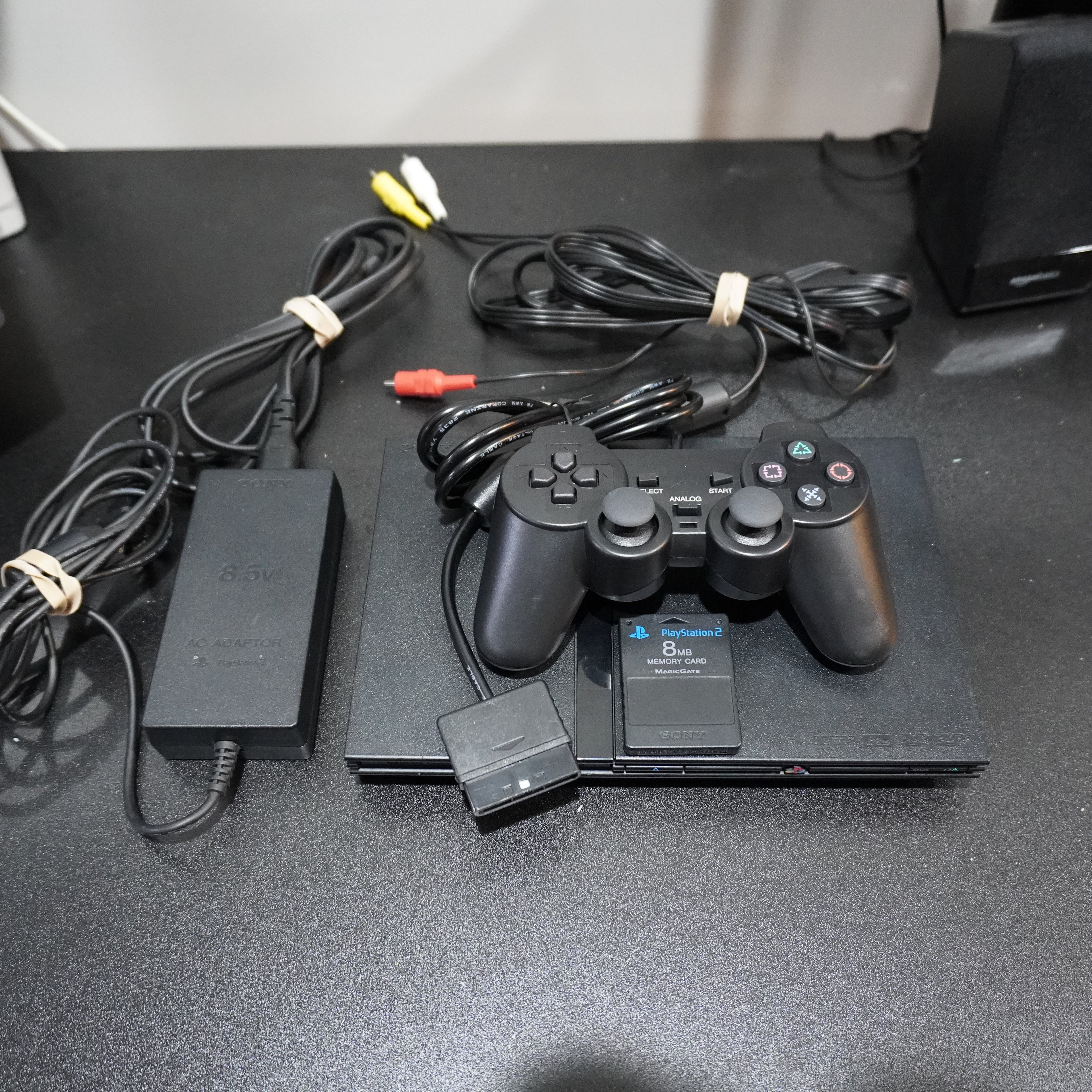 PS2 Slim + 3rd Party Controller + 8mb Memory + AV/Power Cables