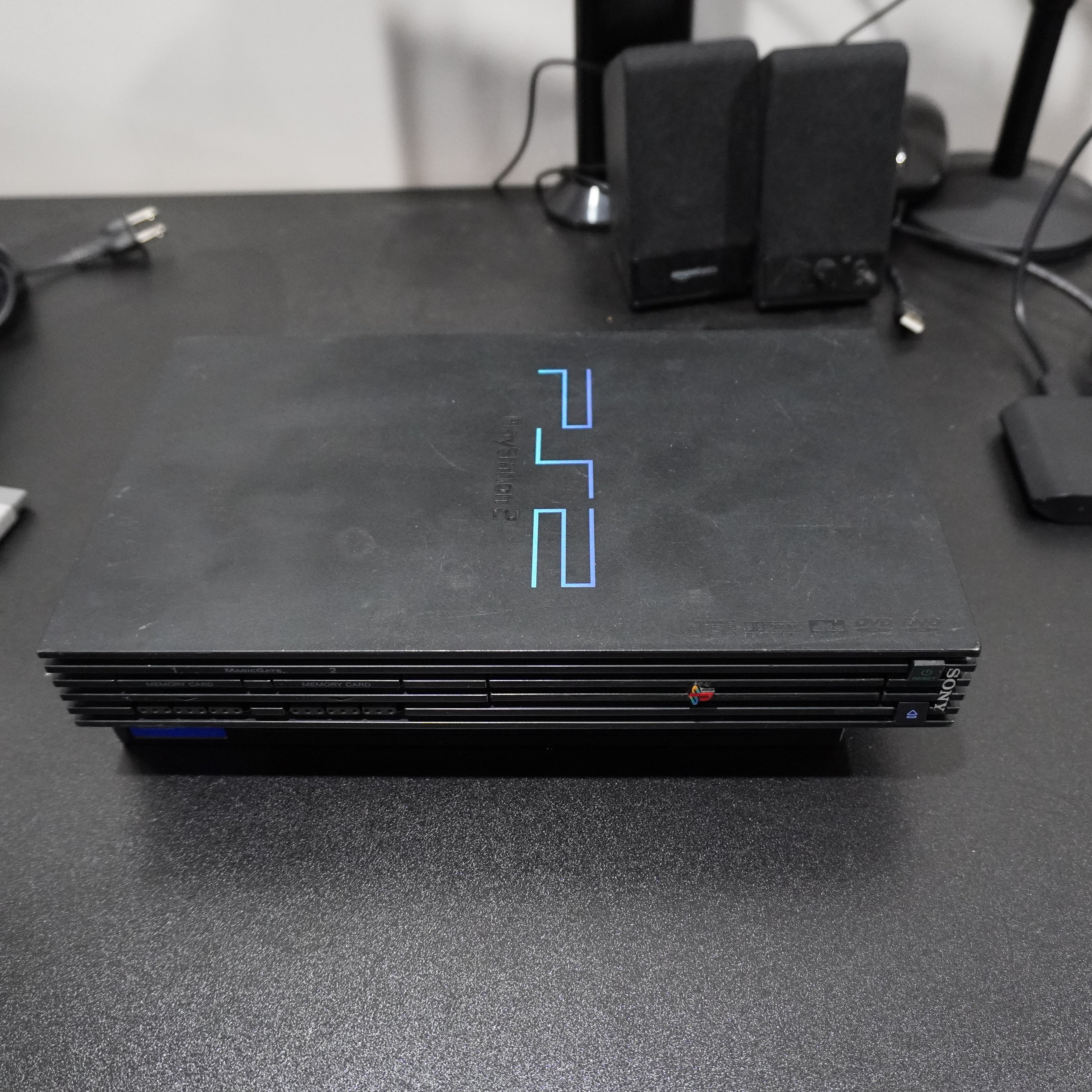 PS2 Fat Model + 2 Controllers + 64MB Memory Card + AV/Power Cables